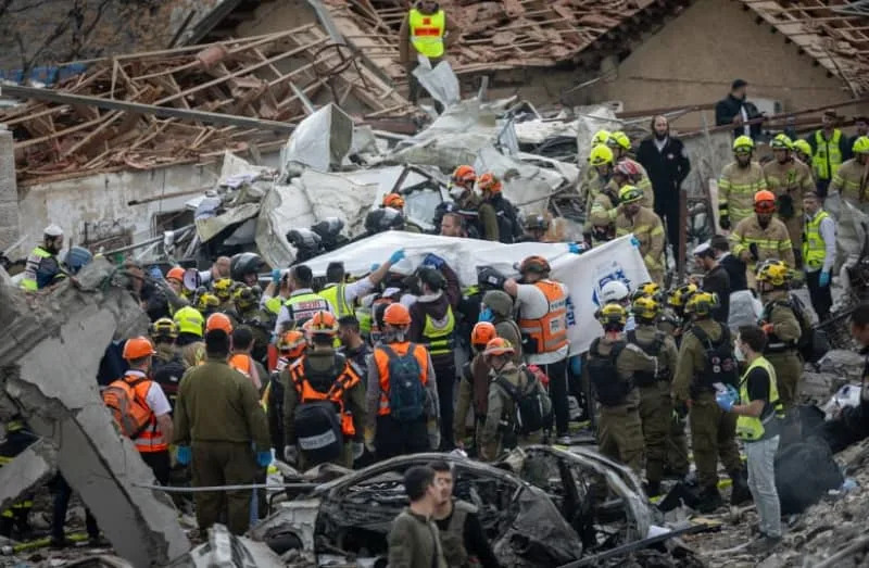 The scene where a ballistic missile fired from Iran hit Bet Shemesh, central Israel, causing heavy damage, March 1, 2026 (credit: YONATAN SINDEL/FLASH90)