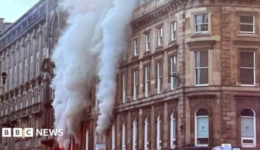 Plumes of smoke rising from a building