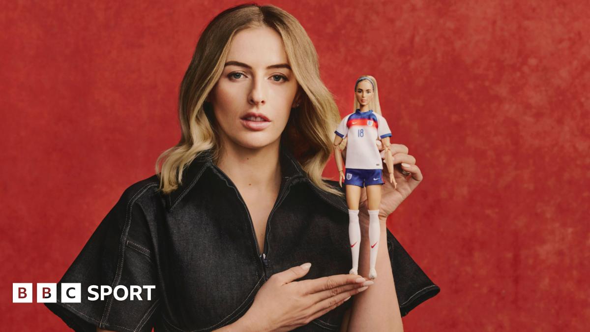 Chloe Kelly poses with the Barbie doll of her likeness