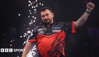 Jonny Clayton celebrates with his arm in the air after winning Premier League darts night six in Nottingham