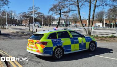 A police car outside a police cordon around an Asda supermarket car park in Sutton in Ashfield in Nottinghamshire on Saturday 14 March 2026.