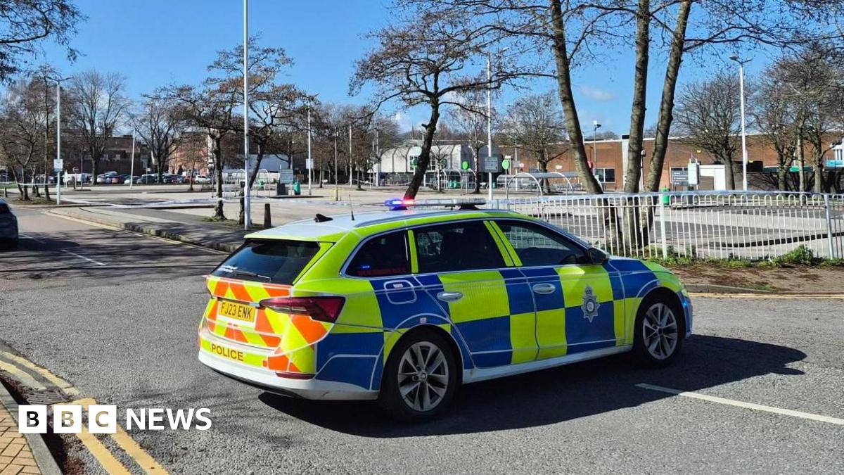 A police car outside a police cordon around an Asda supermarket car park in Sutton in Ashfield in Nottinghamshire on Saturday 14 March 2026.