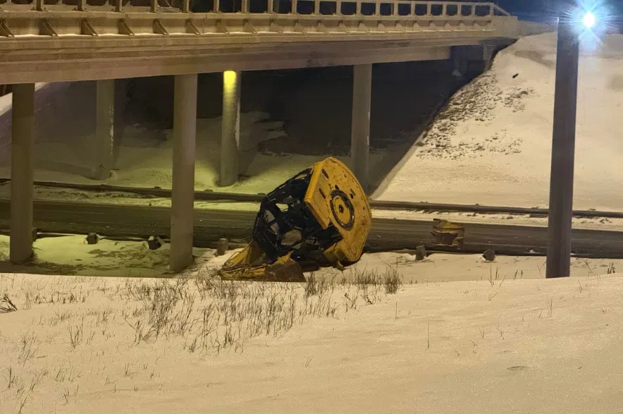Some debris left after a semi-truck hauling equipment crashed into the Highway 11 overpass March 5, 2026.