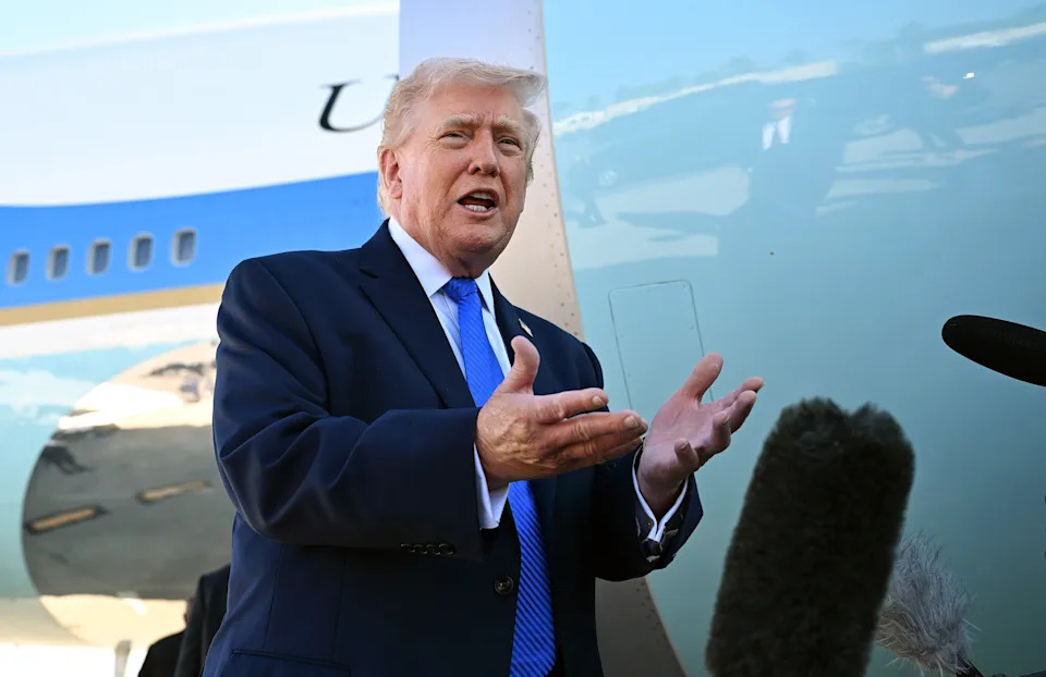 Roberto Schmidt/Getty Images - PHOTO: President Donald Trump speaks to reporters before boarding Air Force One at Palm Beach International Airport, March 23, 2026 in West Palm Beach, Florida.
