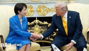 Soldiers marching with guns