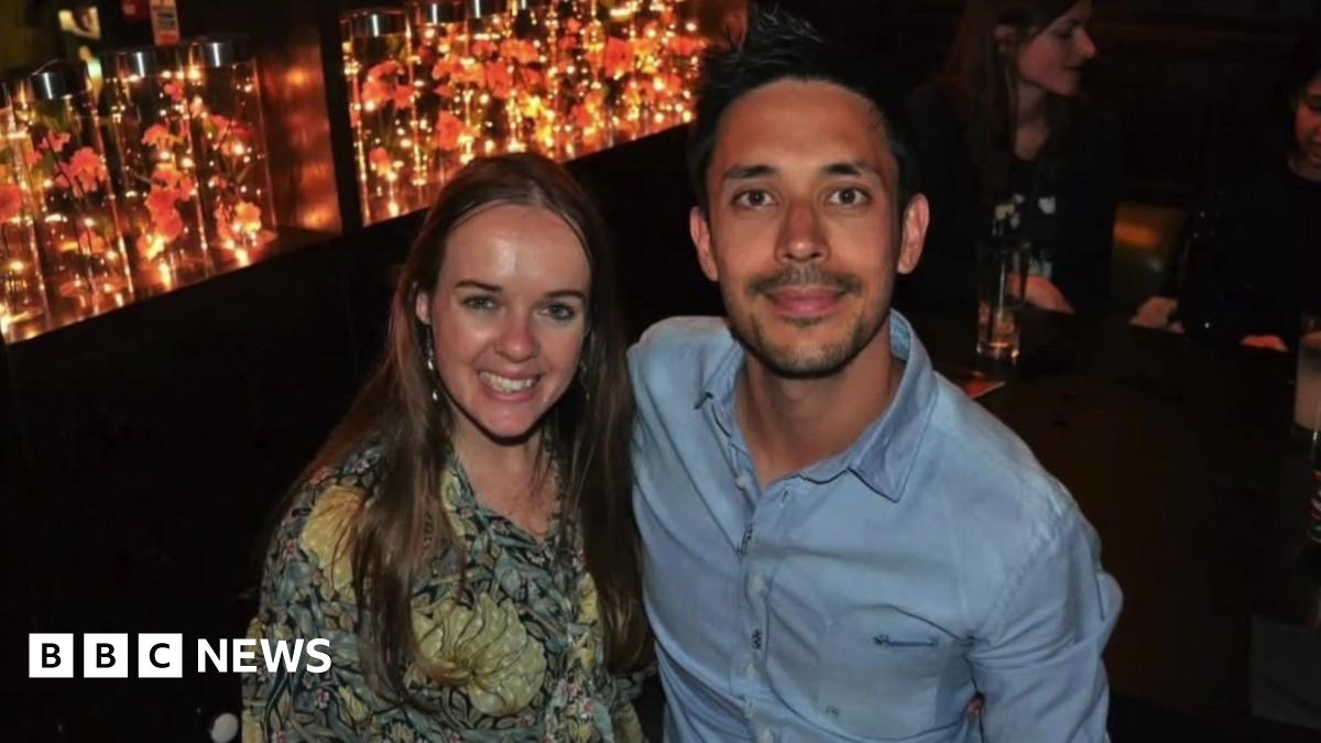 Richard Pugh and Hannah Norman smiling at the camera, dressed to go out. Richard has short dark hair and a goatee, while Hannah has long straight hair.
