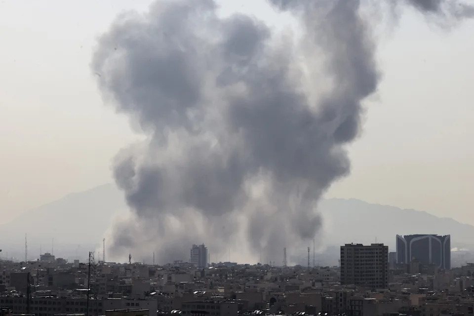 A plume of smoke rises following a reported explosion in Tehran on Feb. 28, 2026. / ATTA KENARE / Atta Kenare/ AFP via Getty Images