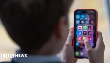 Generic image of a school child using a smartphone to look at social media