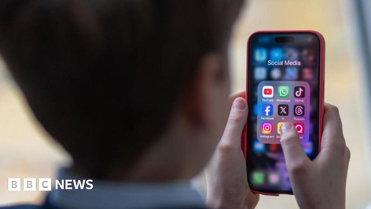 Generic image of a school child using a smartphone to look at social media