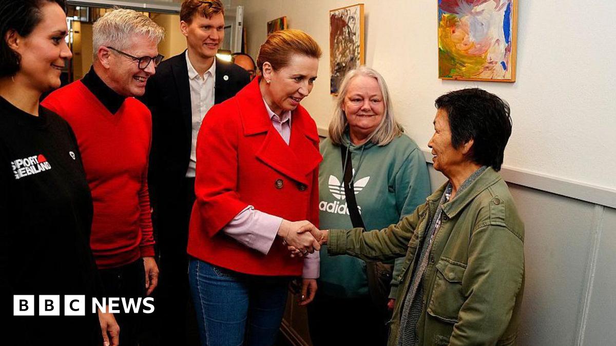Denmark's Prime Minister and Social Democrats' leader Mette Frederiksen (C) meets Greenlandic voters on election day, in Aalborg, on March 24, 2026
