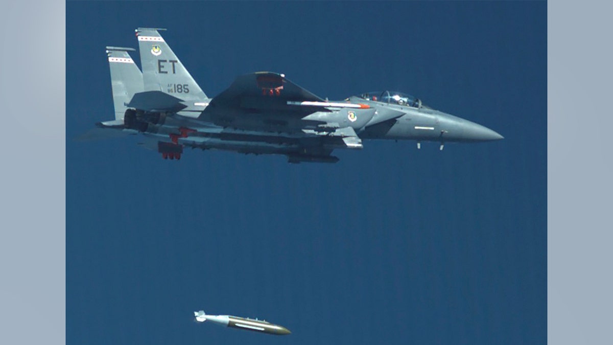 A fighter plane dropping a bomb