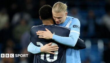 Erling Haaland hugs Mbappe