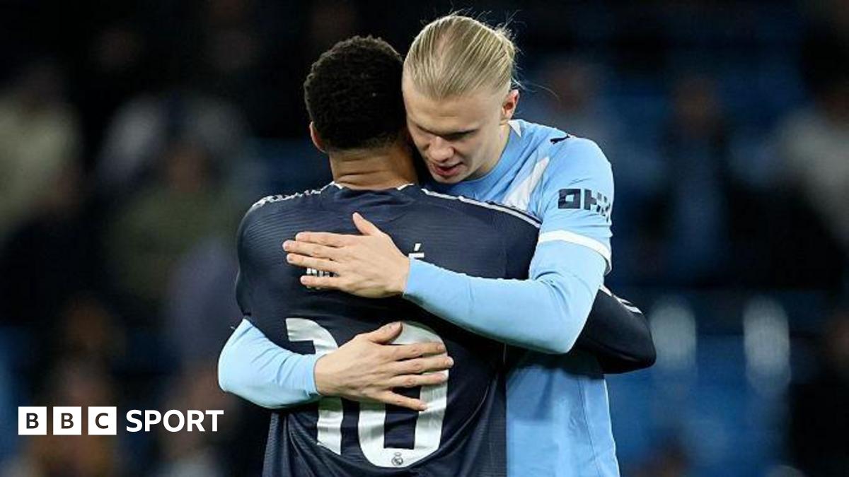 Erling Haaland hugs Mbappe