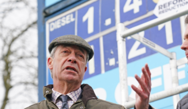 Nigel Farage and Robert Jenrick speaking at a news conference at a petrol station in Derbyshire