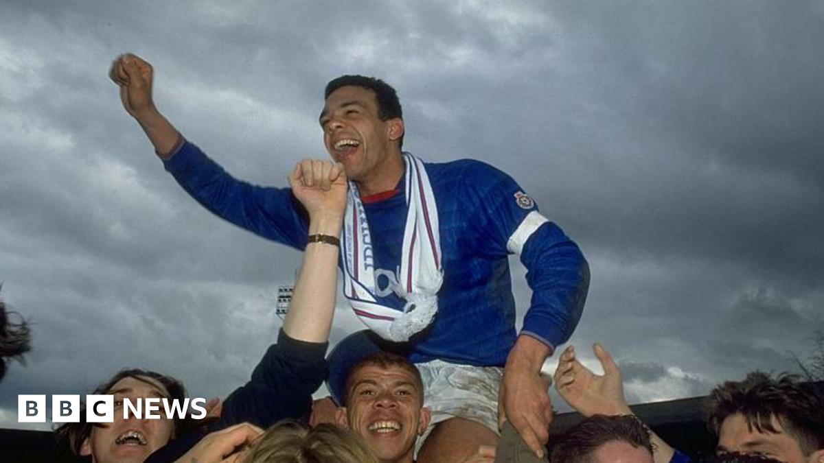 Jason Dozzell being held aloft by fans after an Ipswich Town match against Oxford United in 1992.