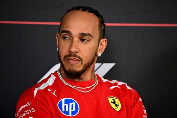 Lewis Hamilton looks on Lewis Hamilton looks on