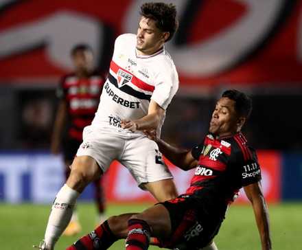 Flamengo's Alex Sandro in action with Sao Paulo's Damian Bobadilla