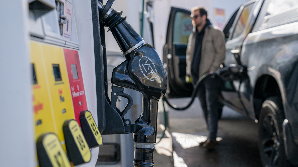 A driver refuels a vehicle with gas at a Shell station in Seattle, Washington on March 9, 2026.
