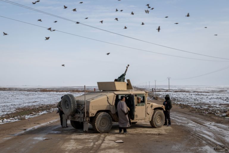 AL HASAKAH, SYRIA - JANUARY 24: YPG fighters operate near a frontline position January 24, 2026 in Al Hasakah, Syria. The fate of Kurdish self-rule in northeast Syria appears increasingly imperilled after weeks of clashes between Syrian government forces and the Kurdish-led SDF, which have forced the SDF to cede large swaths of the region. The United States, which has long backed the Kurdish forces, viewing them as instrumental in the war against ISIS, has shifted its weight behind the new Syrian government, which seeks to integrate the Kurds into the national armed forces. (Photo by Ethan Swope/Getty Images)