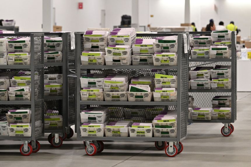 Mail-in ballots are lined up for processing at the Los Angeles County Ballot Processing Center in City of Industry, California, on November 4, 2024.