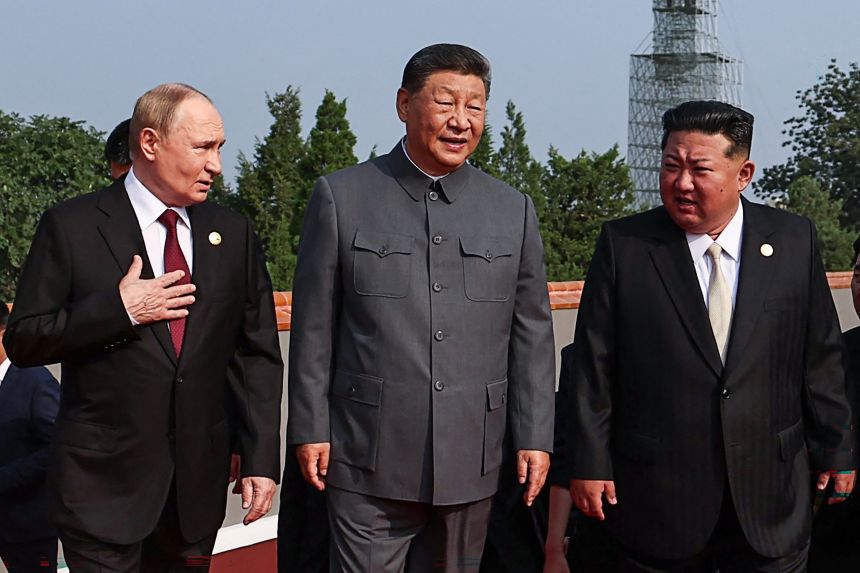 China's Xi Jinping with his guests, Russia's President Vladimir Putin with and North Korea's Kim Jong Un,  before a military parade in Beijing's Tiananmen Square on September 3, 2025.