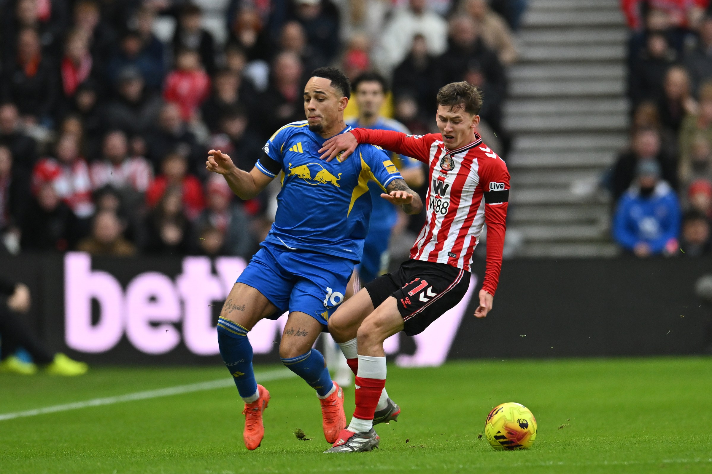 Noah Okafor of Leeds United plays against Chris Rigg of Sunderland during the Premier League match between Sunderland and Leeds United at the Stadium Of Light in Sunderland, England, on December 28, 2025. (Photo by Scott Llewellyn/MI News/NurPhoto via Getty Images)