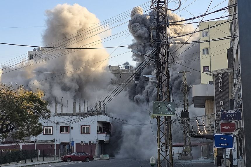 Smoke rises from the site of an Israeli airstrike that targeted the offices of Al-Qard al-Hassan, a Hezbollah-linked financial institution, in the southern coastal Lebanese city of Tyre on March 2.