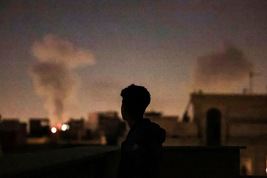 A plume of smoke rises after a strike on Tehran.