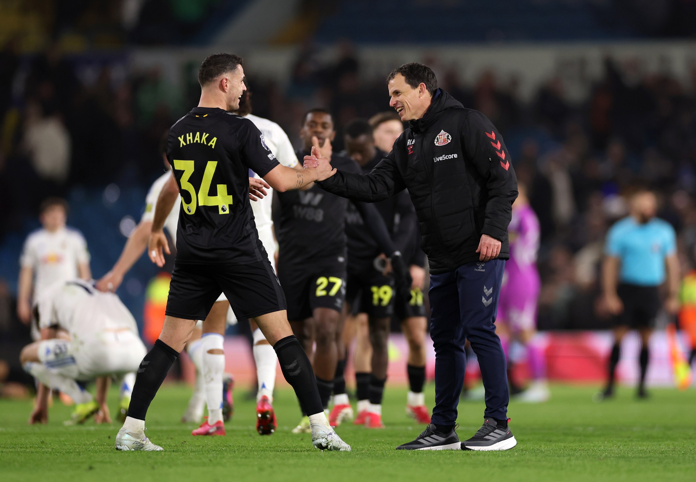 LEEDS, ENGLAND - MARCH 03: Regis Le Bris, Manager of Sunderland, and Granit Xhaka celebrate after victory in the Premier League match between Leeds United and Sunderland at Elland Road on March 03, 2026 in Leeds, England. (Photo by Stu Forster/Getty Images)
