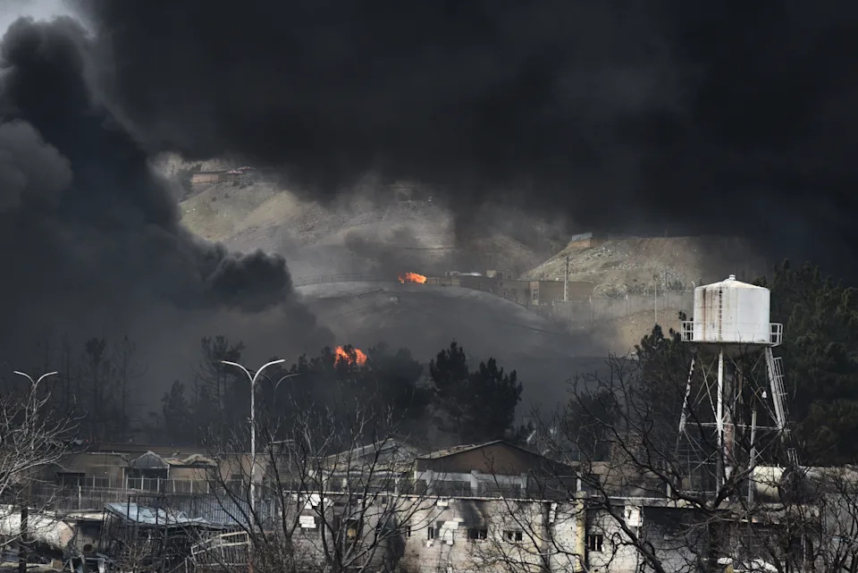 Plumes of smoke rise over the oil depot tanks hit by joint Israel-U.S. over night in a station north west of the capital on March 8, 2026 in Tehran, Iran.