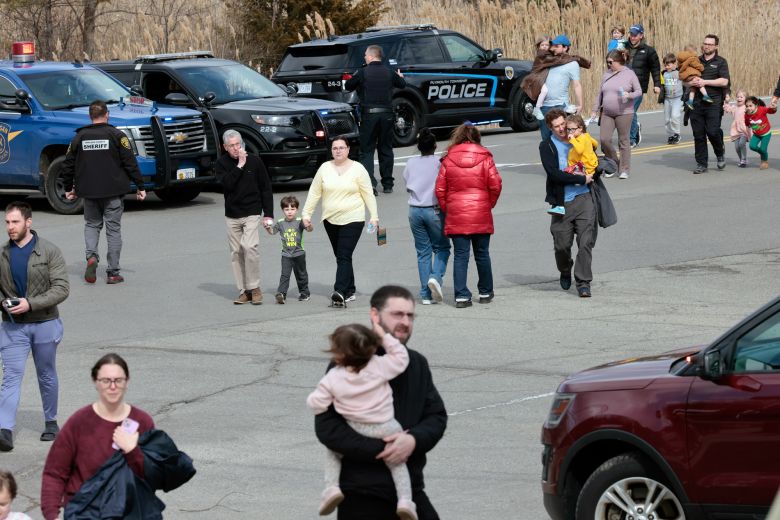 Families leave after being reunited outside Temple Israel synagogue.