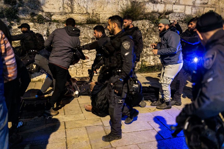 Israeli security forces disperse Muslim worshippers who were performing the nightly Tarawih prayers outside the old city walls of Jerusalem on Tuesday.