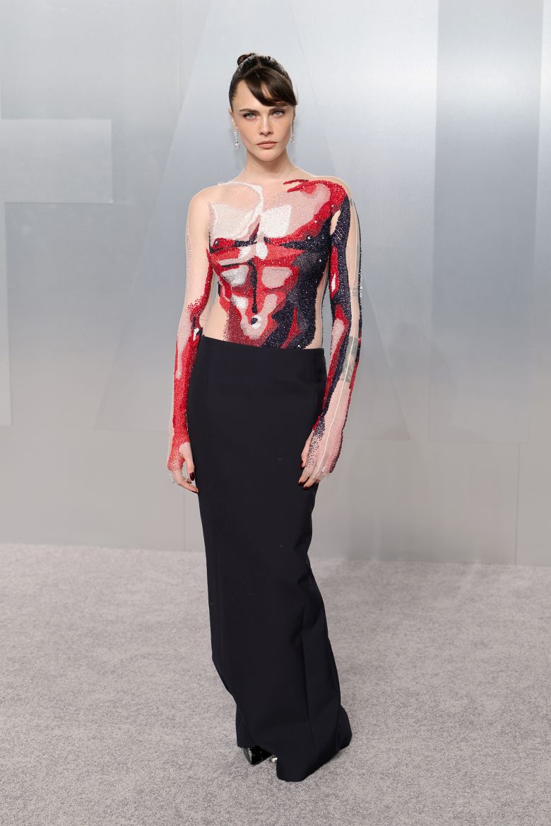 Cara Delevingne brought a twist on the naked dress cliché with a Thom Browne gown that depicted a male torso rendered in crystals.