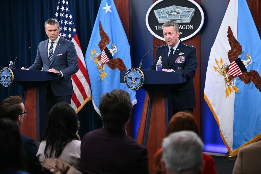 US Secretary of Defense Pete Hegseth, left, and Chairman of the Joint Chiefs of Staff General Dan Caine speak during a news conference at the Pentagon March 19.