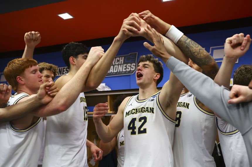 Will Tschetter of the Michigan Wolverines celebrates the win against the Howard Bison on Thursday.