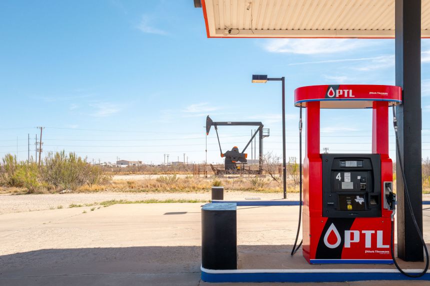 A pumpjack is seen behind a gas station in Odessa, Texas, on March 17, 2026.