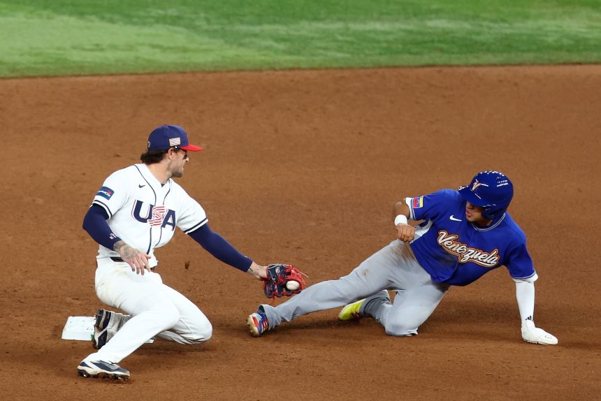 Javier Sanoja of Team Venezuela steals second base in front of the tag by Brice Turang of Team United States during the ninth inning. He'd go on to score the winning run.