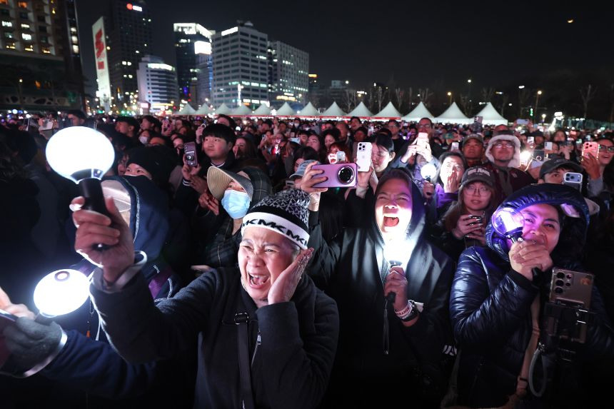 Fans of BTS cheer during the comeback concert.