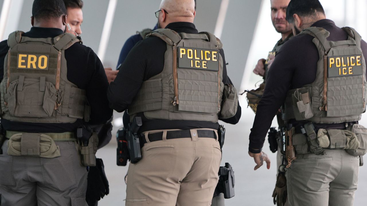 mmigration and Customs Enforcement agents patrol Terminal B at LaGuardia Airport on Monday, March 23, in New York.
