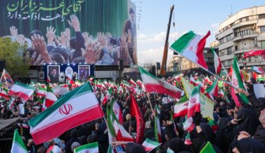 Demonstrators wave Iranian national flags as they gather for a rally in support of the new Supreme Leader at Enghelab Square in central Tehran on March 9, 2026. Iran marked the appointment of Ayatollah Mojtaba Khamenei to replace his father as Supreme Leader after Ayatollah Ali Khamenei was killed in joint U.S. and Israeli strikes on February 28.