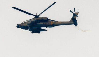 An Israeli Air Force AH-64 Apache attack helicopter flies at a position along the border between northern Israel and southern Lebanon on March 26, 2026. (AFP Photo)