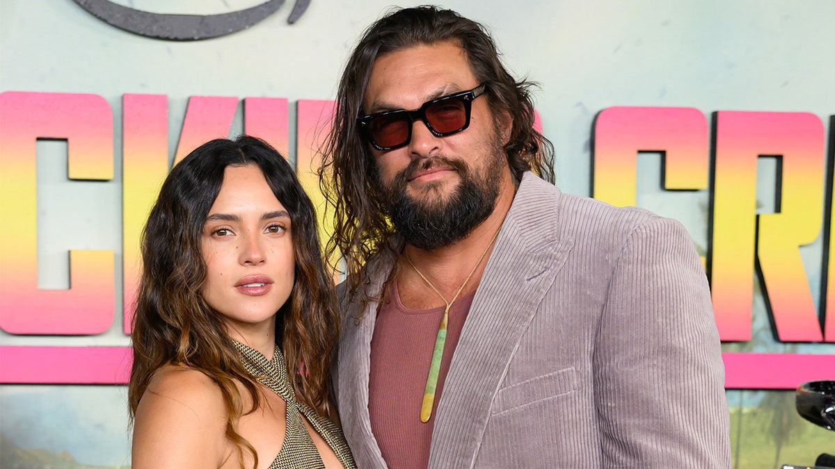 Jason Momoa walks red carpet with Adria Arjona