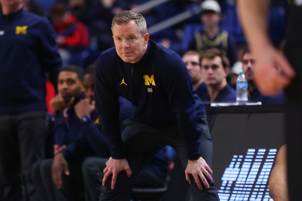 Michigan head coach Dusty May watches his team during the second half of a college basketball game.