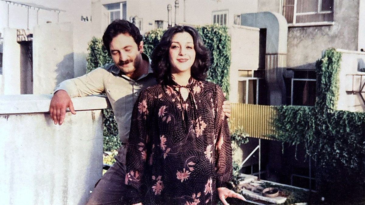 An Iranian man and woman are photographed in their native country.