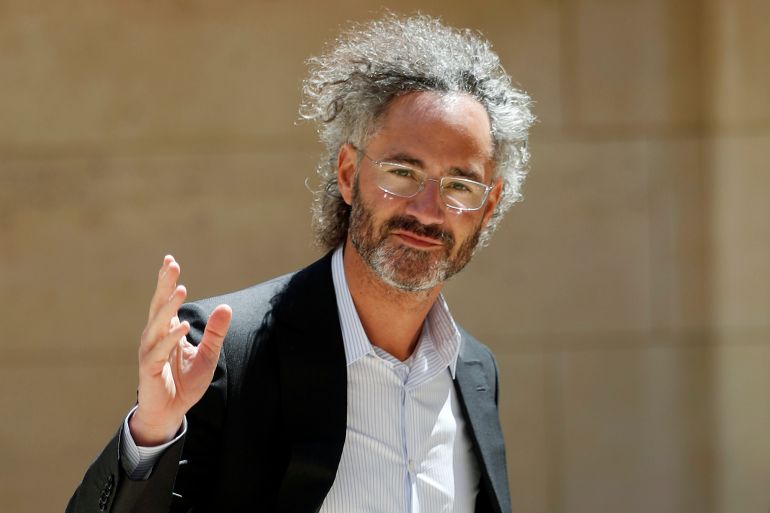 FILE - In this Wednesday, May 15, 2019, file photo, Palantir CEO Alex Karp arrives for the Tech for Good summit in Paris. Seventeen years after it was born with the help of CIA seed money, Palantir Technologies is finally going public. (AP Photo/Thibault Camus, File)