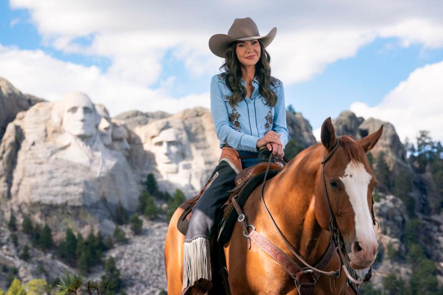 DHS Secretary Kristi Noem seen riding a horse in front of Mount Rushmore for a DHS ad on Oct. 2, 2025.