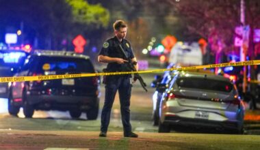 A police officer at the scene on West 6th Street at West Avenue. Pic: AP