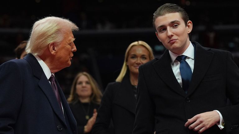 Barron Trump, right, and his father President Donald Trump, left, in Washington in 2025. Pic: AP