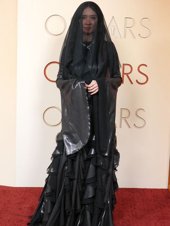 Best director nominee Chloe Zhao, veiled in black and silver. Pic: AP