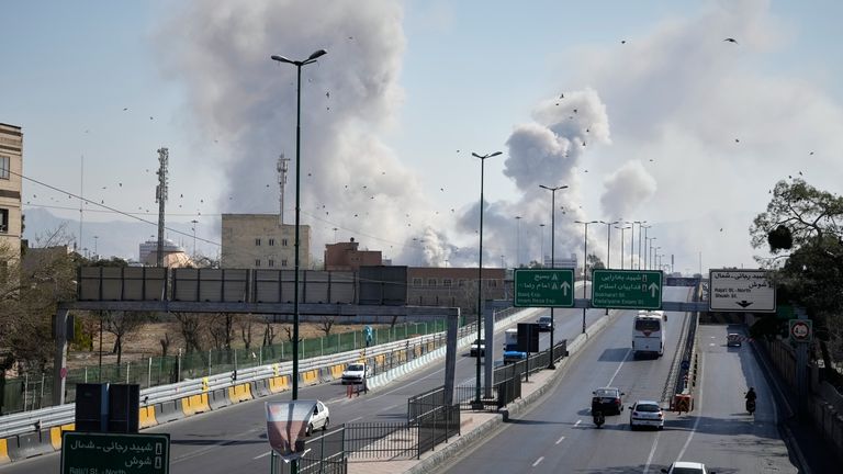 Plumes of smoke rise as strikes hit Iran's capital Tehran on 5 March. Pic: AP